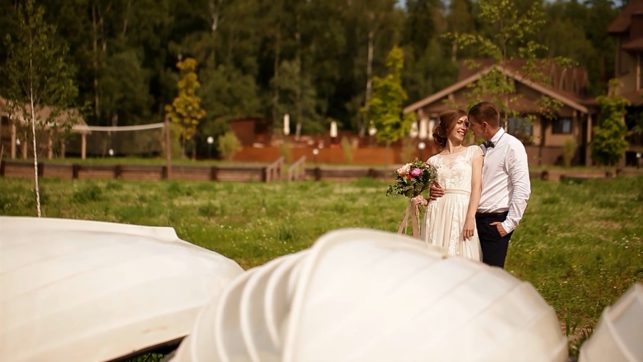 bride and groom kissing in the open air
