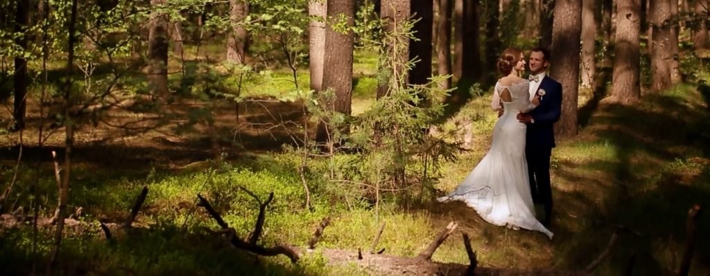 A bride and groom in a forest