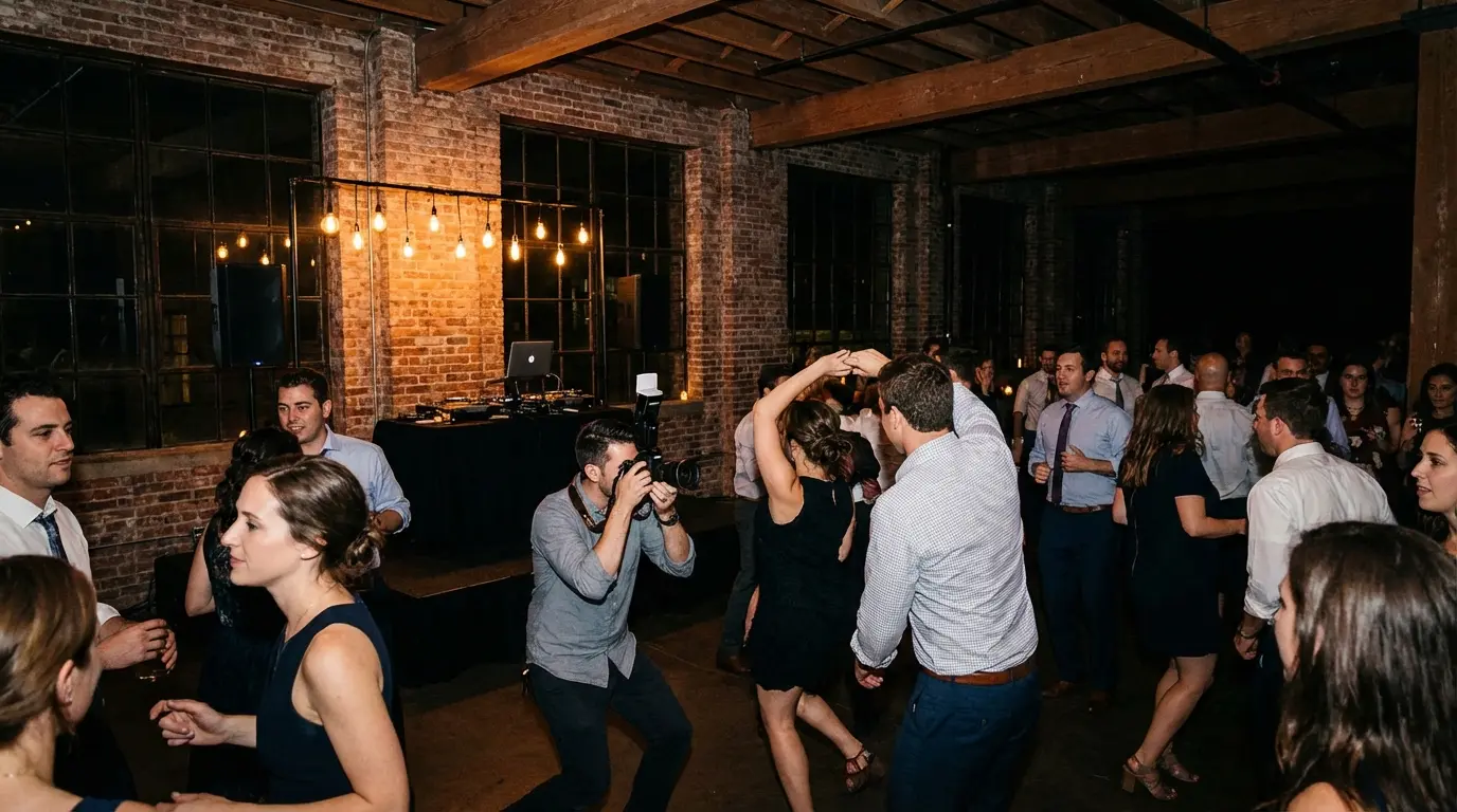 Event photographer shooting dance floor at a Brooklyn loft party, capturing guests dancing
